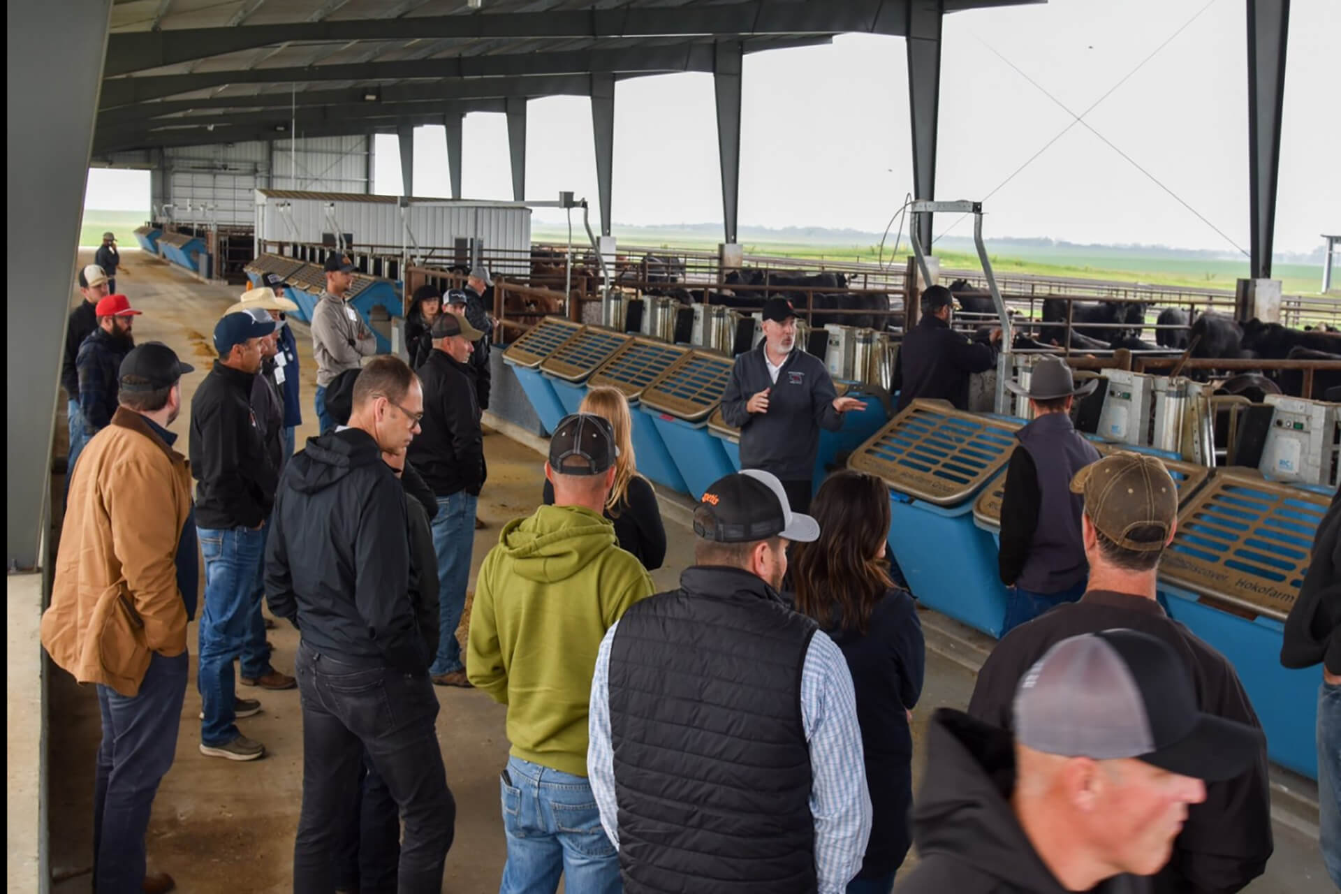 The Beef 706 and Merck Animal Health participants gathered in the feeding barn to learn from Galen Erickson.