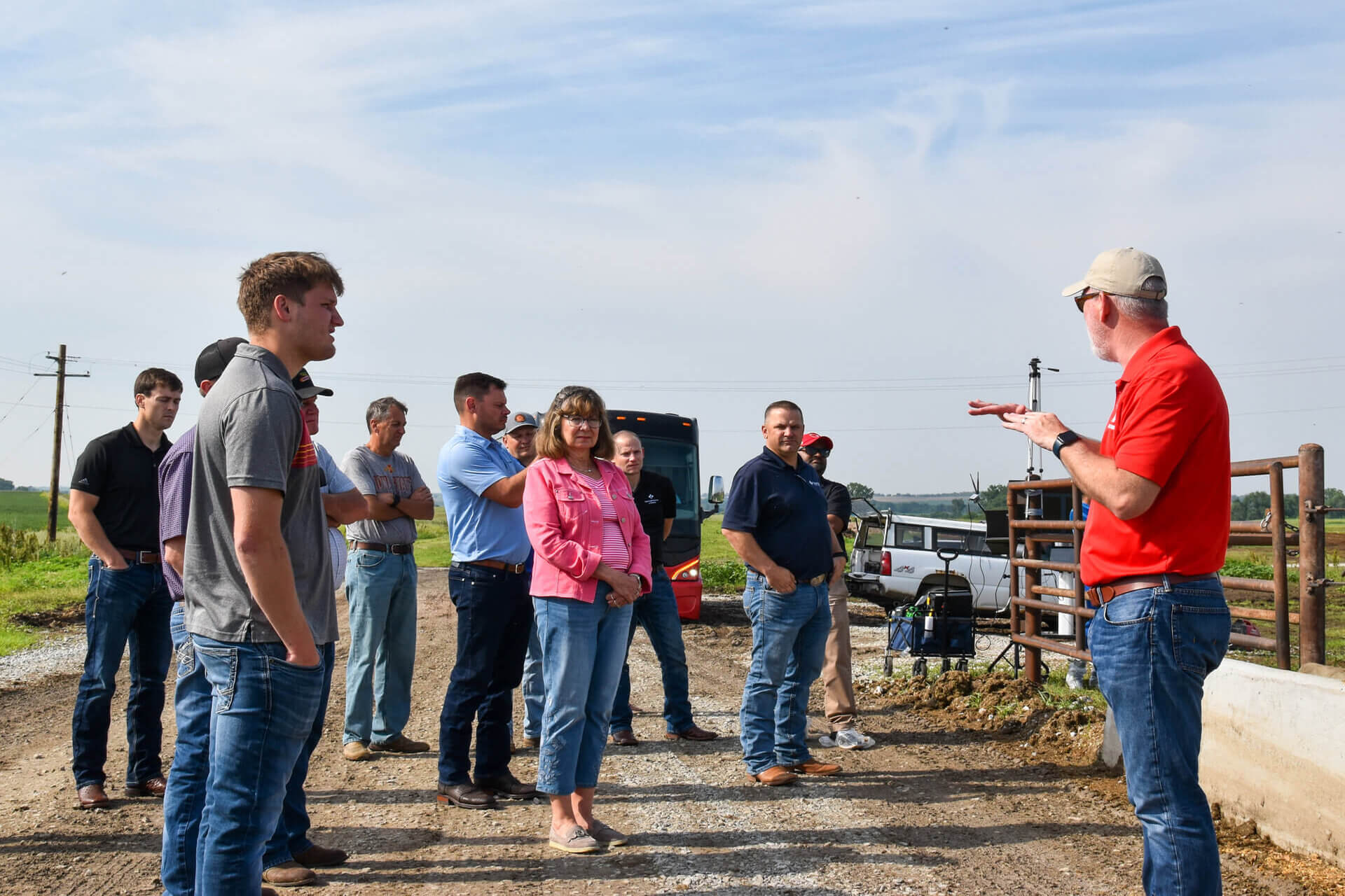 Farm Credit beef producer tour group at KFIC pens