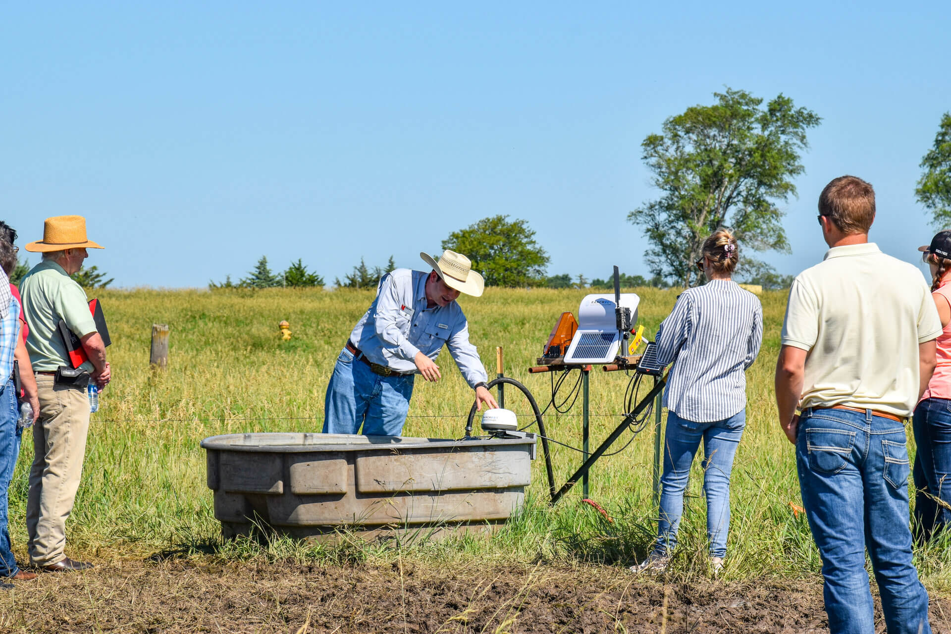 Smart stock tank sensor demonstration and discussion in pasture 