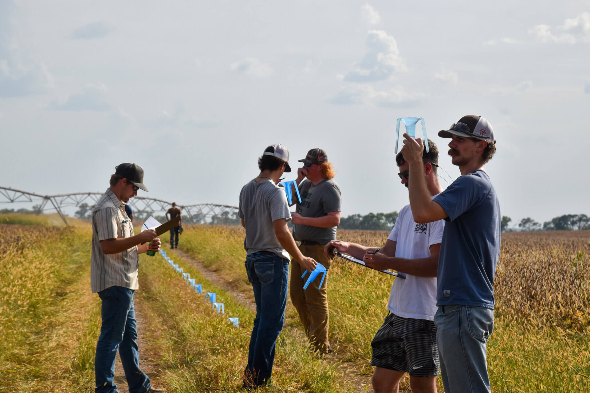 Students participating in irrigation lab in the field 