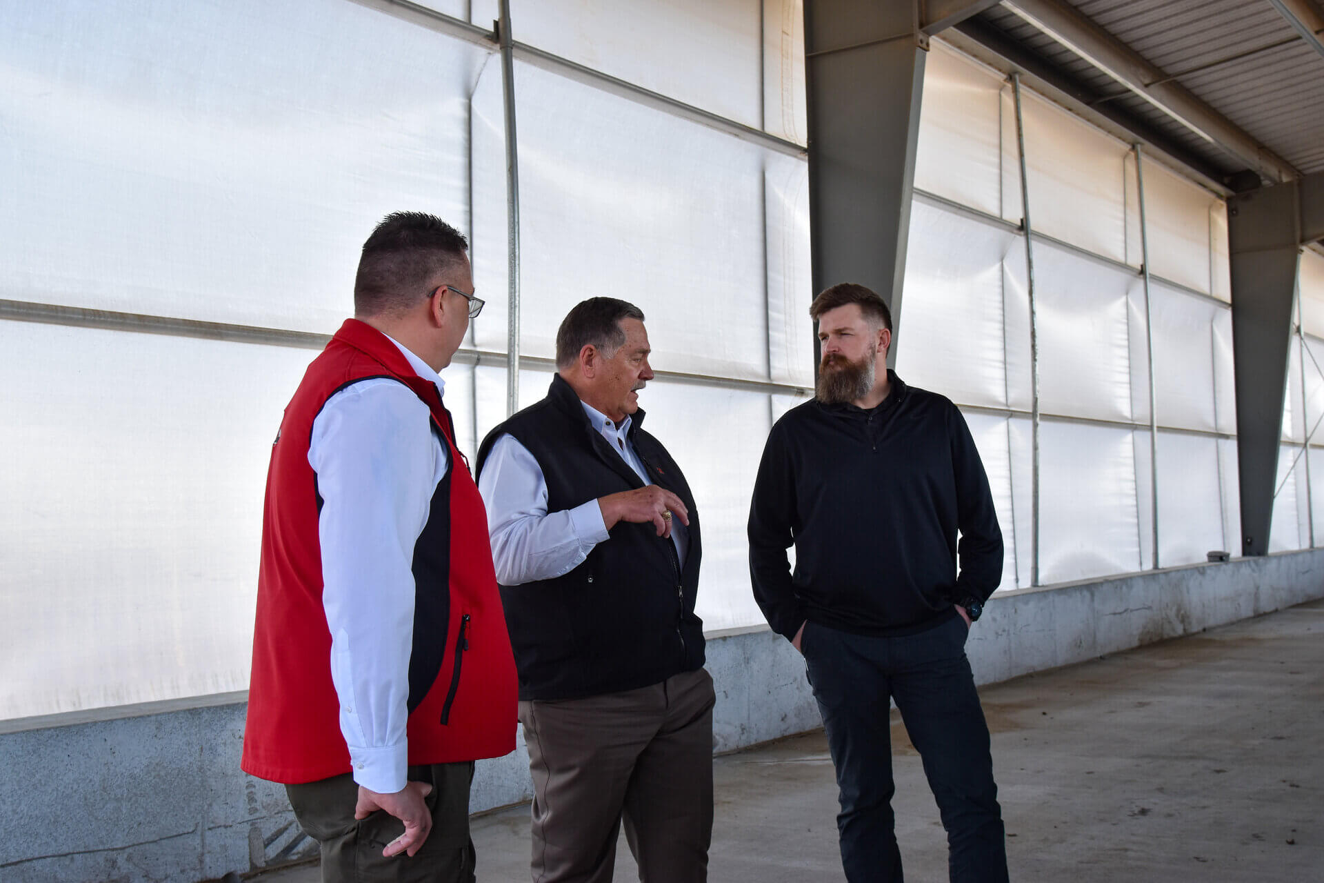 UrbanGmbH Germany members learning about feeding technology from director Doug Zalesky in Klopfenstein feedtech barn at KFIC