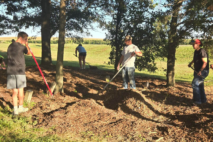 The Allen FFA Chapter spreading mulch in the Northeast Arboretum at the Haskell Ag Lab.