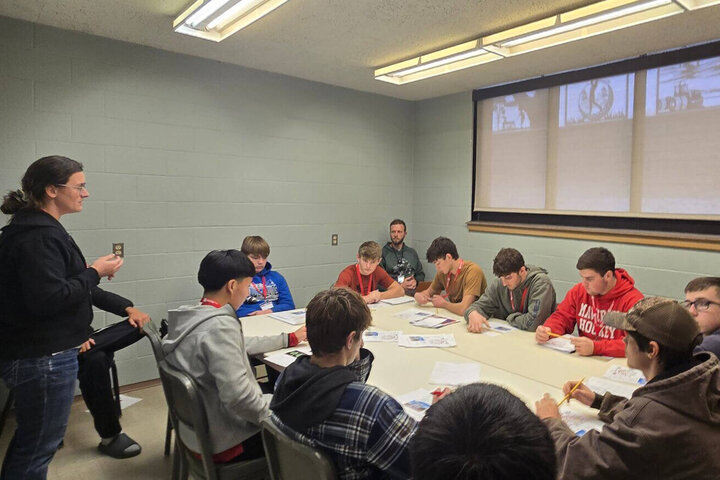Students in a table session learning about careers at Haskell Ag Lab.
