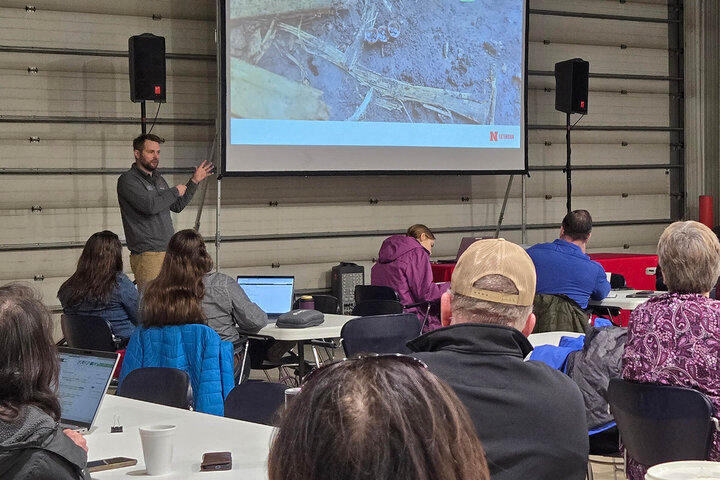 University Plant Pathologist talking to a large crowd about corn disease at the Northeast Nebraska Crops Update.