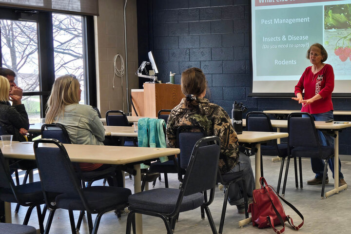 Carol Larvick discussing growing fruit in the backyard at Springfest.